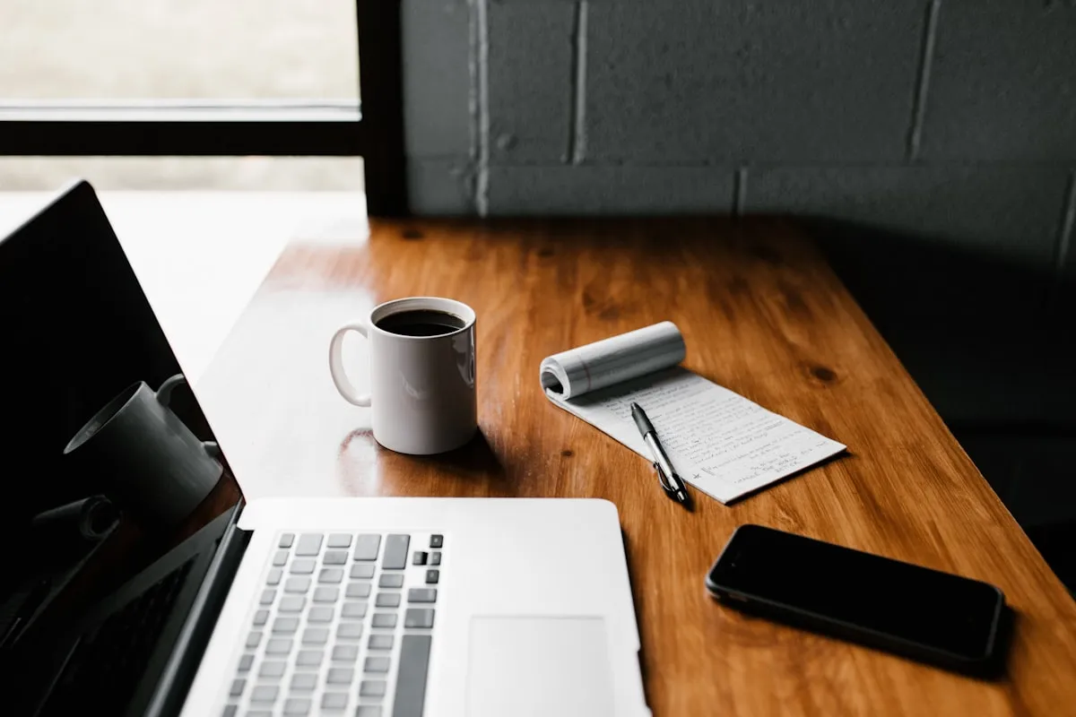 Workspace where website content is being edited on a laptop